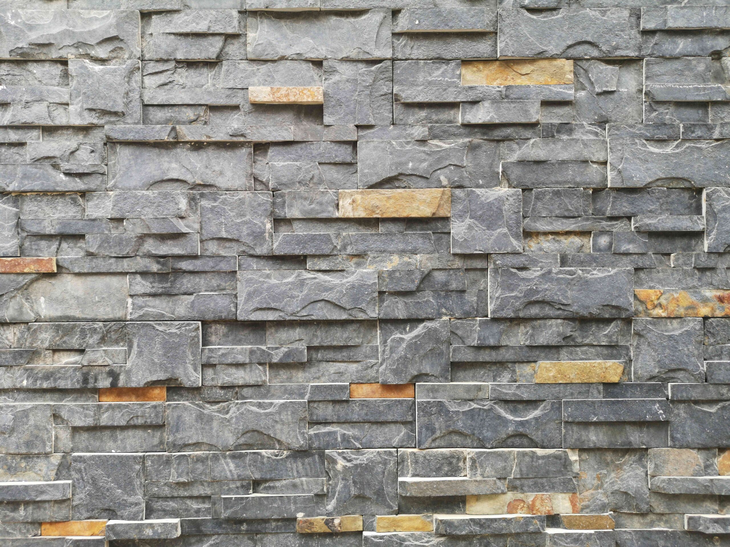 Terrace parapet wall with stone cladding finish in residential house